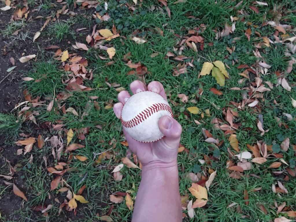 Bottom view of a hand demonstrating how to grip a four-knuckle knuckleball