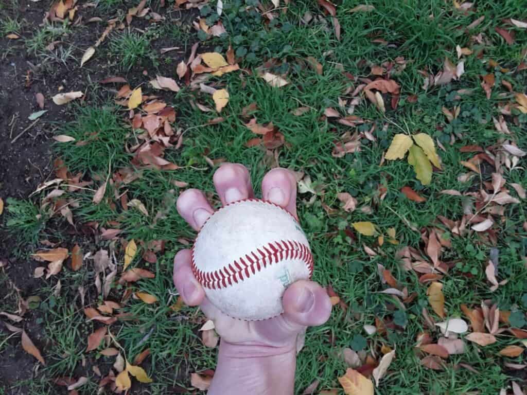 Bottom view of a hand demonstrating how to grip a three-knuckle knuckleball