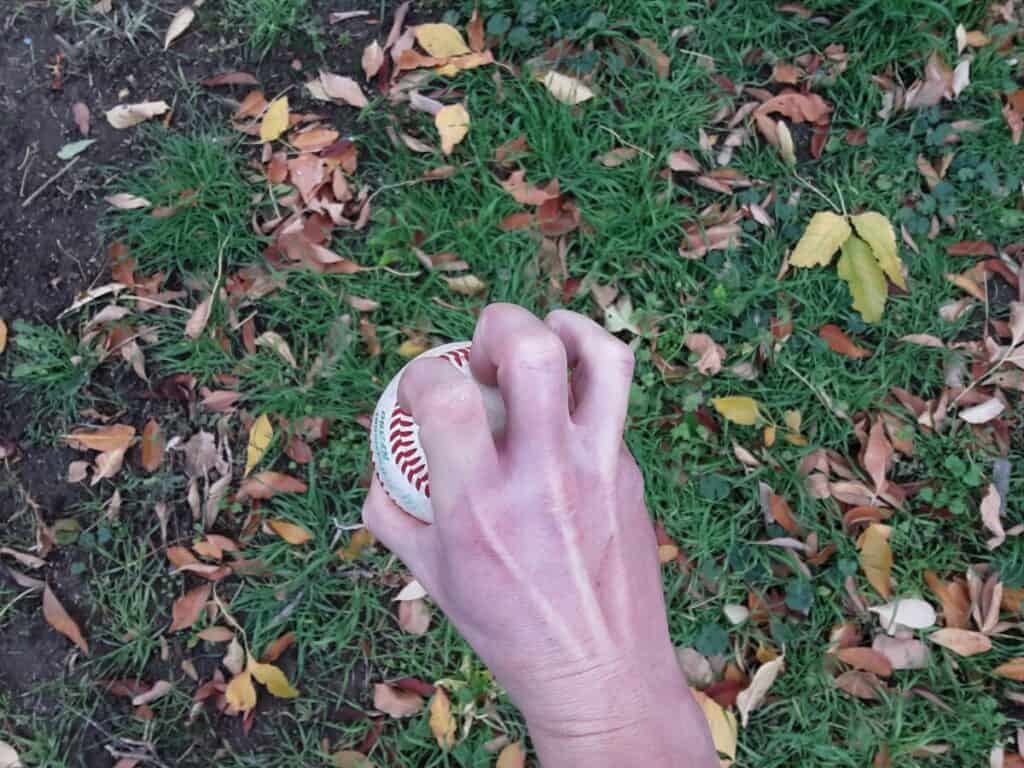 Top view of a hand demonstrating how to grip a three-knuckle knuckleball