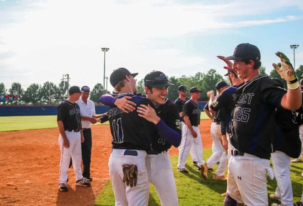 Baseball teammates celebrating a victory