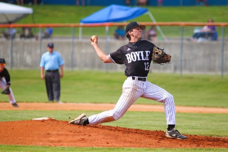 Boyle baseball pitcher wearing number 12 delivering a pitch