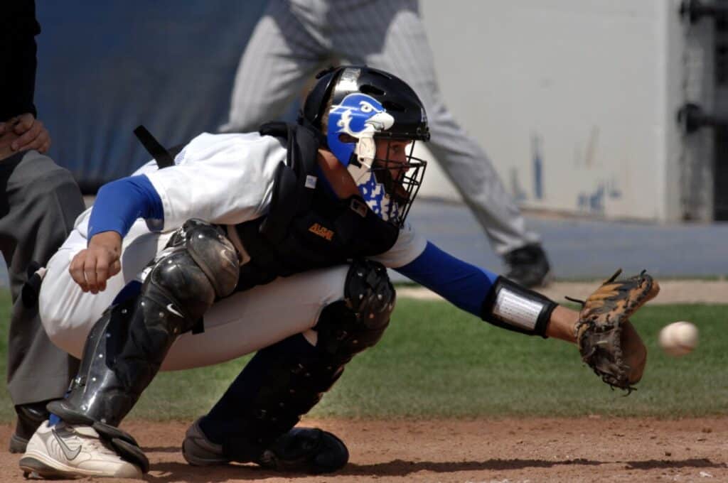 Closeup of a catcher who is just about to catch a pitch