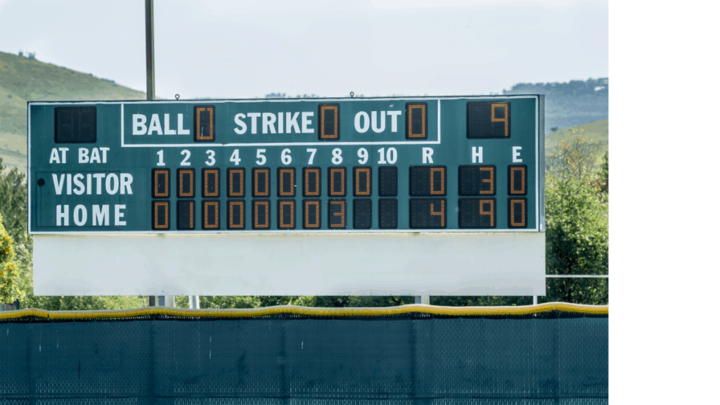 A baseball scoreboard located just beyond the outfield fence