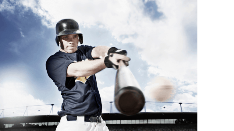 Looking upward at a baseball hitter making contact with a pitch