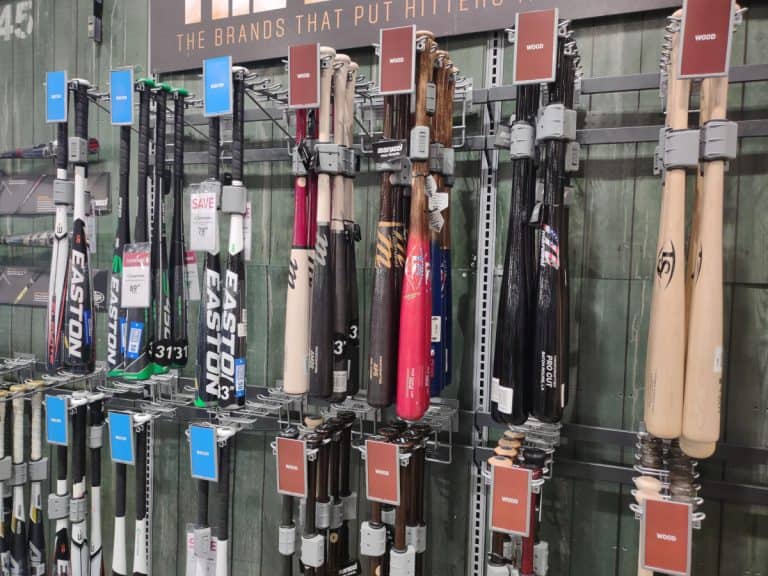 A variety of new wood and aluminum baseball bats on display at Dick's Sporting Goods