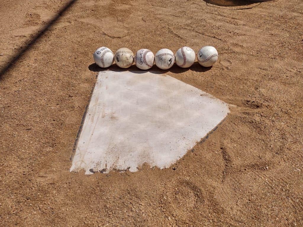 Home plate is six baseballs in length