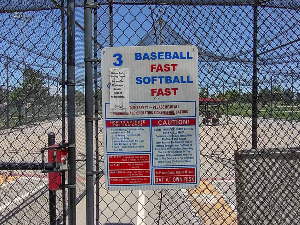 Closeup of sign on batting cage 3 at Pioneer Park in Commerce City, Co