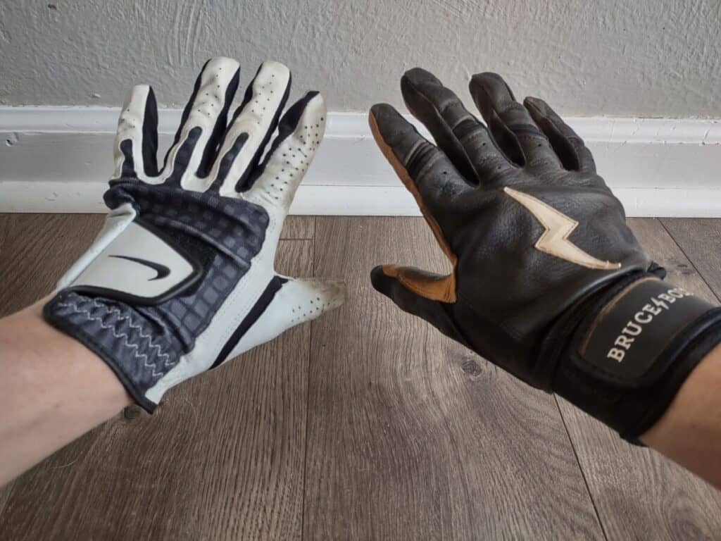 Back-of-the-hand view of the left hand wearing a Nike golf glove and the right hand wearing a Bruce Bolt batting glove