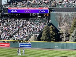 MLB pitch clock behind center field at Coors Field with 2 minutes and 10 seconds left