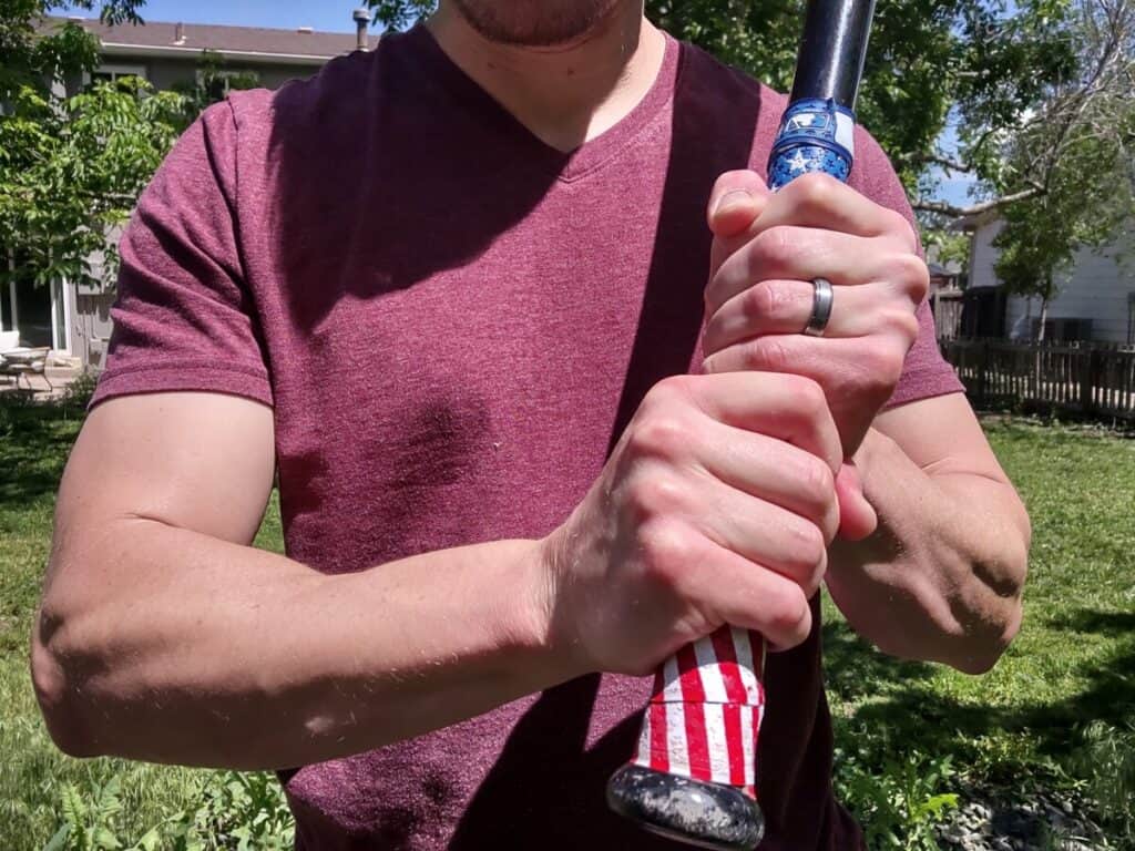 Demonstrating how to choke up on a baseball bat